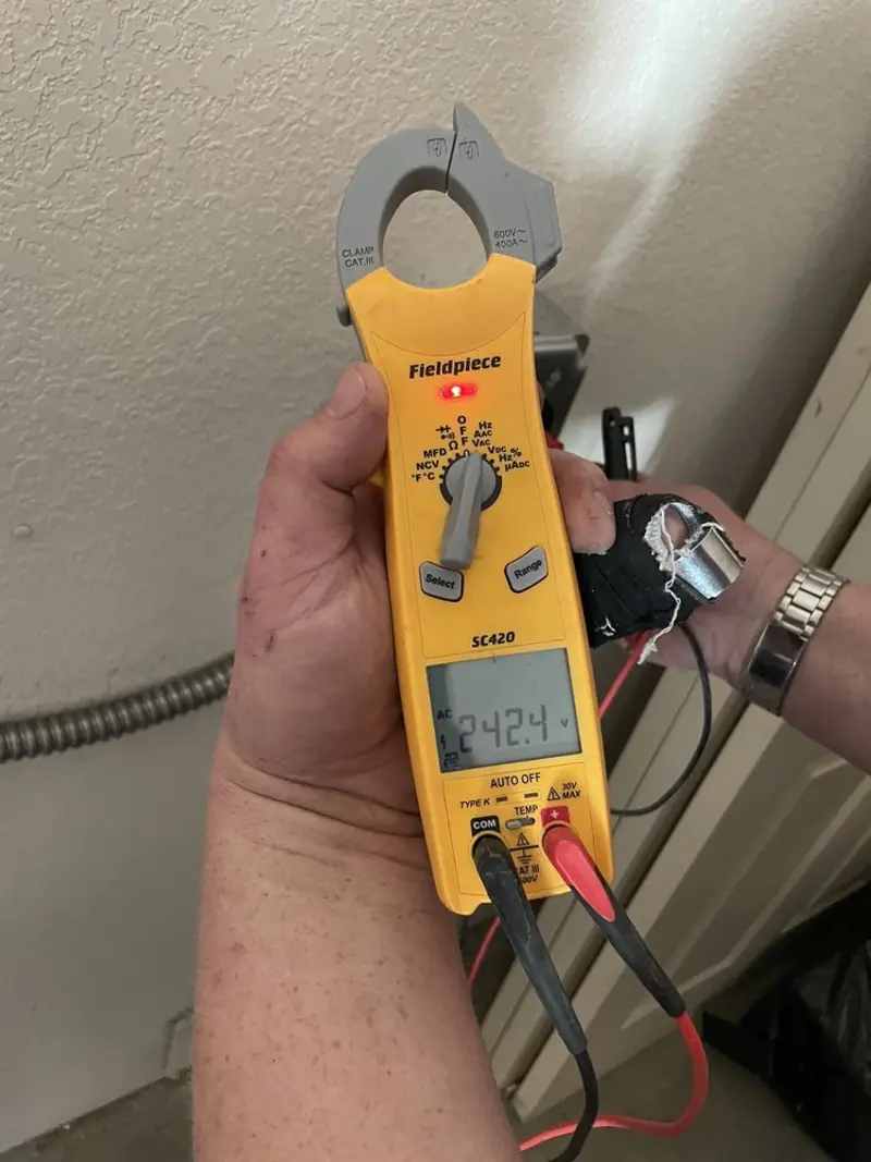 Voltage testing with clamp meter during Ceiling Fan Installation in Strongsville